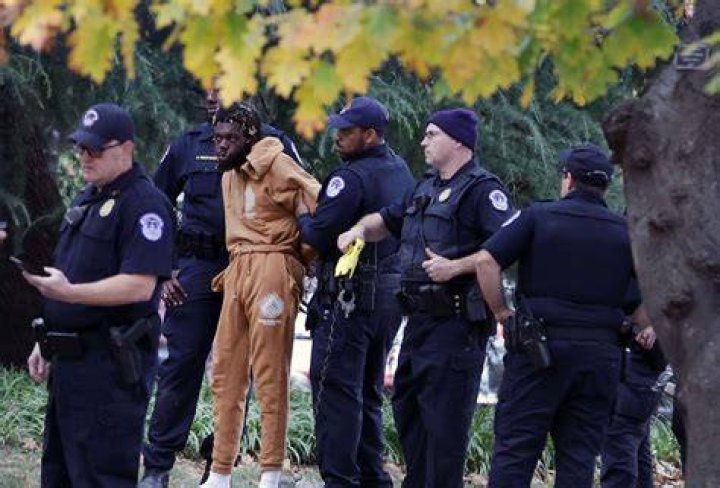 A Black pastor sues the police who arrested him while watering his neighbors' flowers |